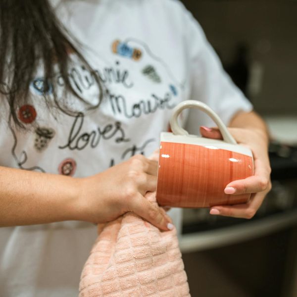 Calendar and a cup of tea, symbolizing integration of a new habit into daily life.